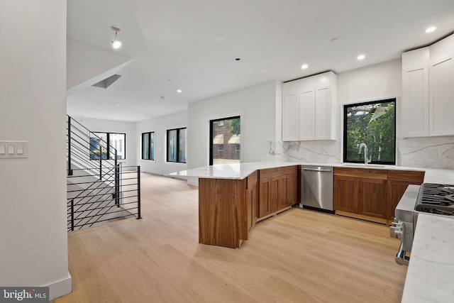 706 Latona St Unit J, Philadelphia, PA 19147 - kitchen featuring dishwasher, a sink, a peninsula, light wood-style flooring, and recessed lighting