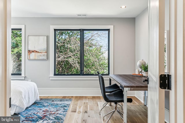 office area with hardwood / wood-style flooring