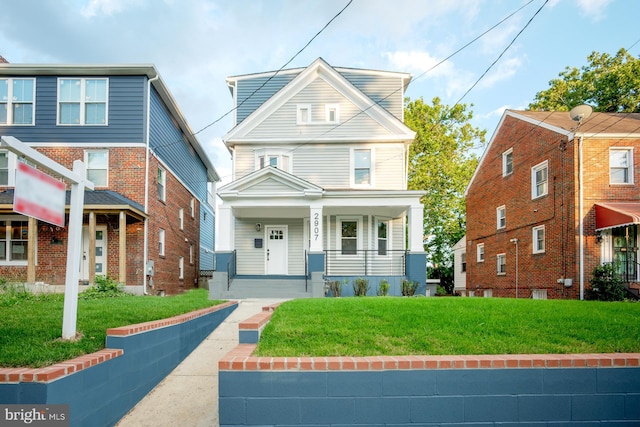 front of property with a front yard and a porch