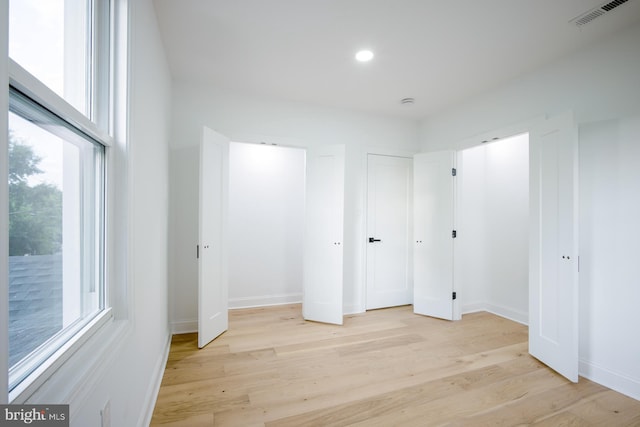 unfurnished bedroom with light hardwood / wood-style floors