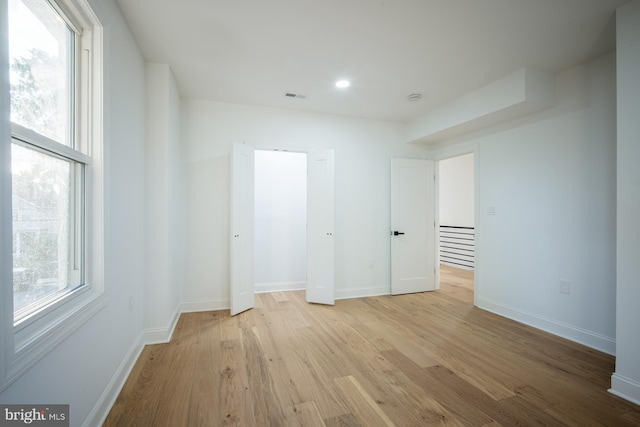 unfurnished bedroom with light wood-type flooring