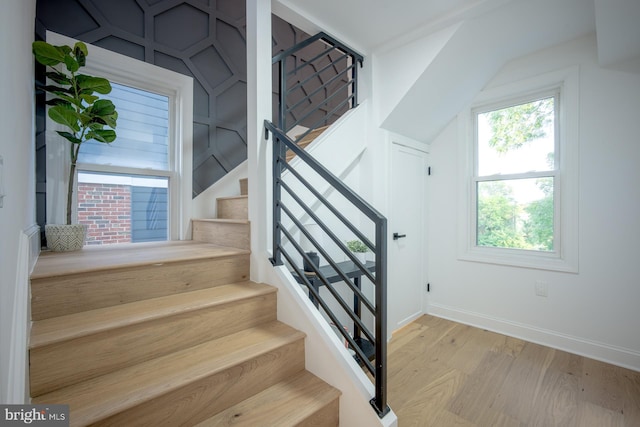 staircase featuring hardwood / wood-style floors