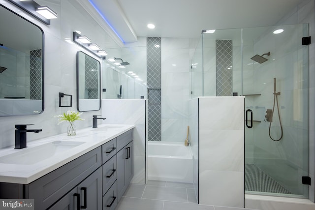 bathroom with backsplash, vanity, plus walk in shower, and tile patterned floors