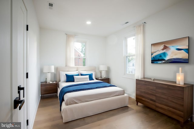 bedroom with light wood-type flooring