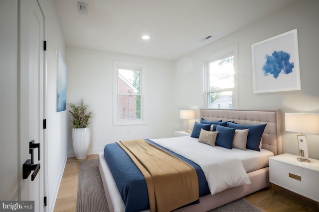 bedroom with light hardwood / wood-style flooring