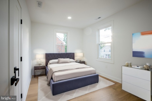 bedroom with light wood-type flooring