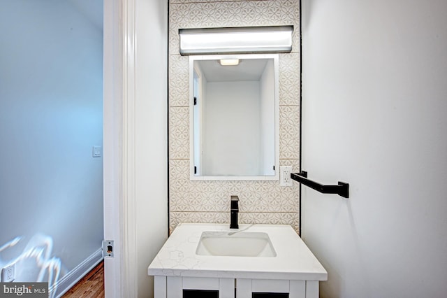 bathroom with hardwood / wood-style floors and vanity