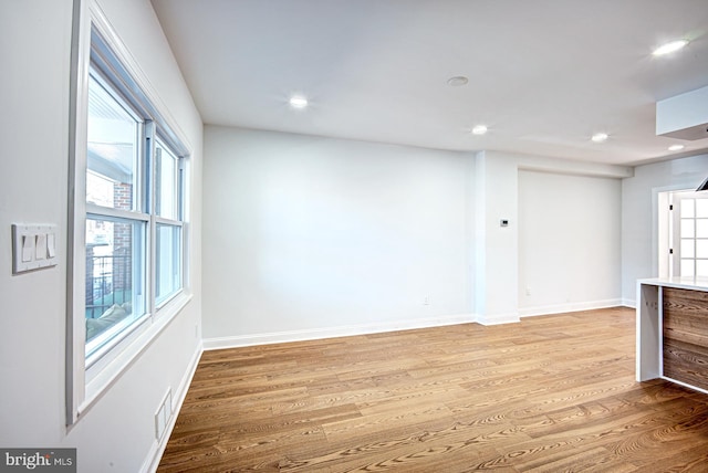 unfurnished room featuring light wood-type flooring