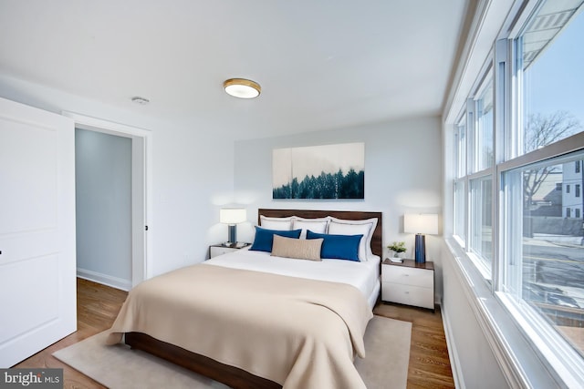 bedroom featuring dark hardwood / wood-style flooring