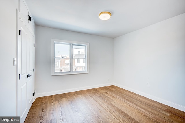 empty room with hardwood / wood-style floors