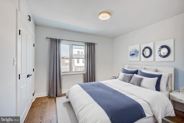 bedroom featuring dark hardwood / wood-style flooring