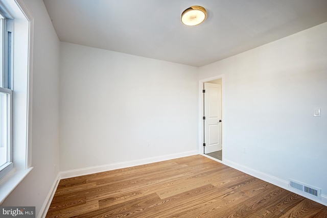 unfurnished room with light hardwood / wood-style floors