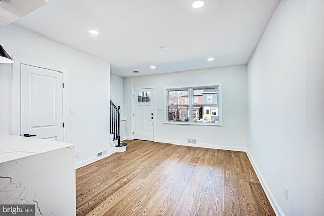 empty room featuring wood-type flooring