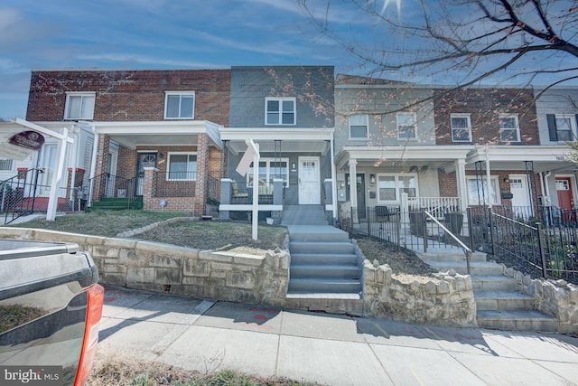 multi unit property featuring a porch