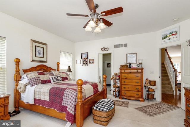 carpeted bedroom featuring ceiling fan