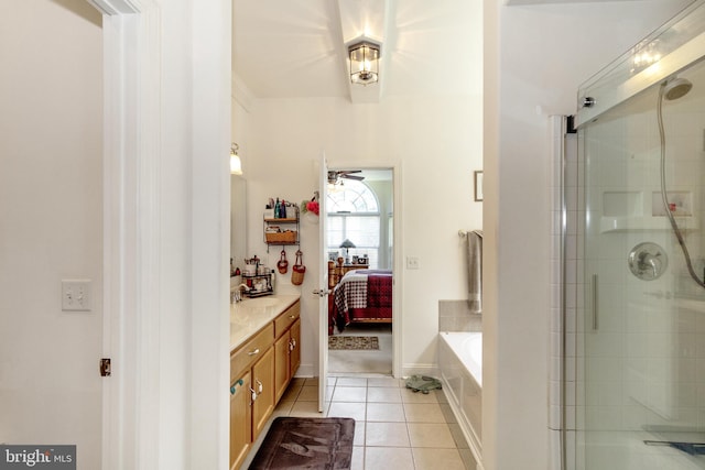 bathroom with vanity, tile patterned flooring, and separate shower and tub