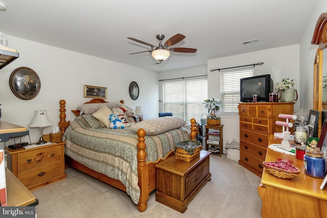 carpeted bedroom featuring ceiling fan