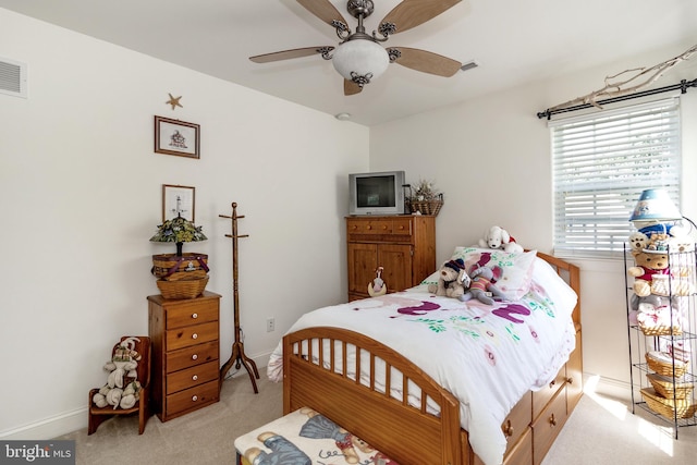 carpeted bedroom with ceiling fan