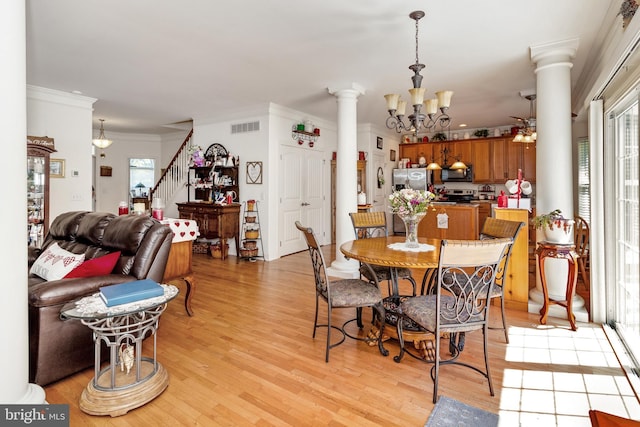 19045 Carey Ln, Georgetown, DE 19947 - dining room featuring a healthy amount of sunlight, visible vents, and ornate columns