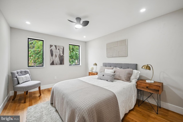 bedroom with wood-type flooring and ceiling fan