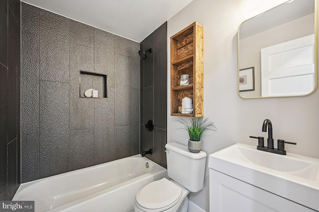 full bathroom with tiled shower / bath, vanity, and toilet