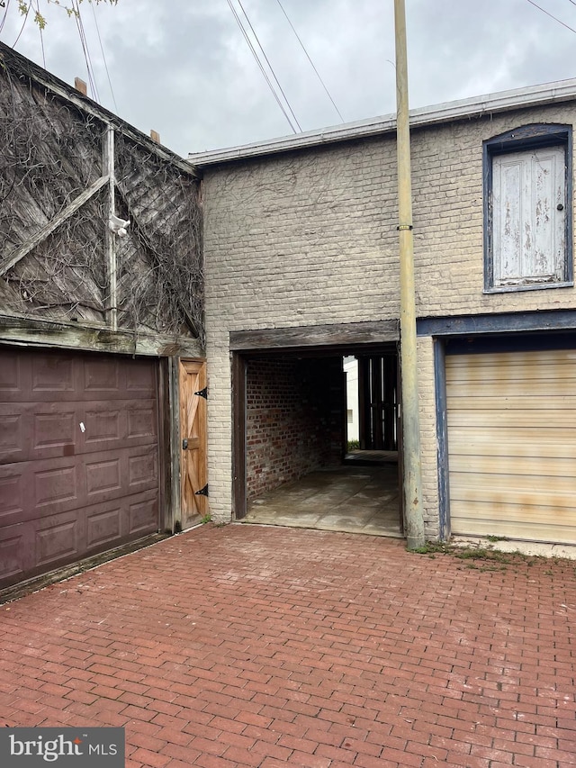 view of side of home with a garage