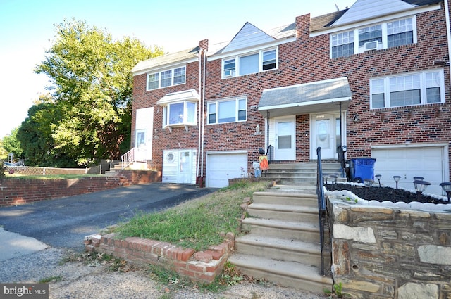 townhome / multi-family property with a garage