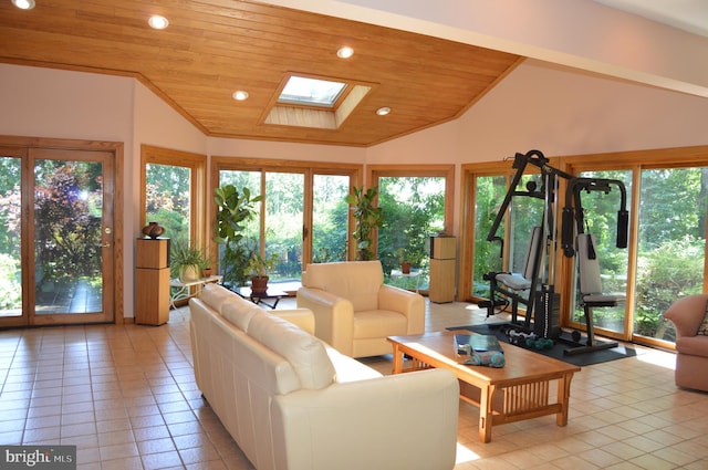 tiled living room featuring wood ceiling, a skylight, and high vaulted ceiling