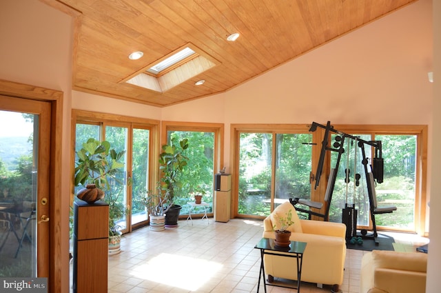 sunroom / solarium featuring wood ceiling and lofted ceiling with skylight