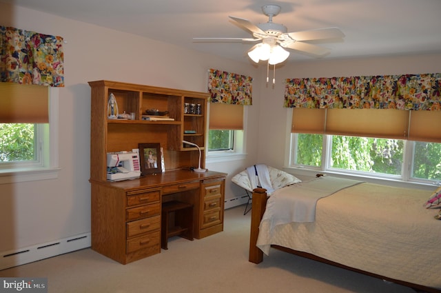 bedroom with a baseboard heating unit, ceiling fan, and light colored carpet