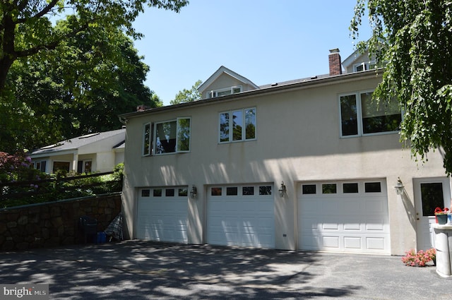 view of front of home with a garage