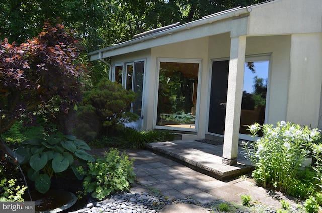 entrance to property featuring a patio