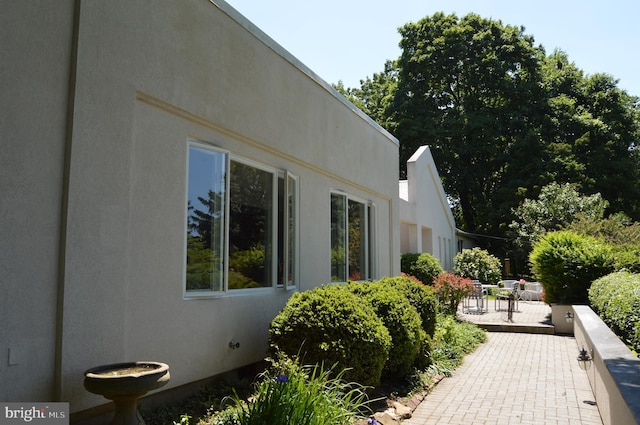 view of property exterior featuring a patio