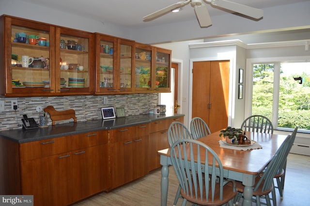 dining room featuring light hardwood / wood-style floors and ceiling fan