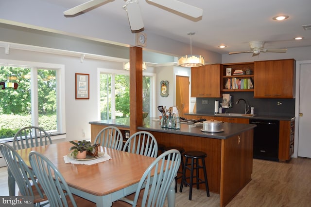 interior space with tasteful backsplash, dark hardwood / wood-style flooring, dishwasher, ceiling fan, and sink