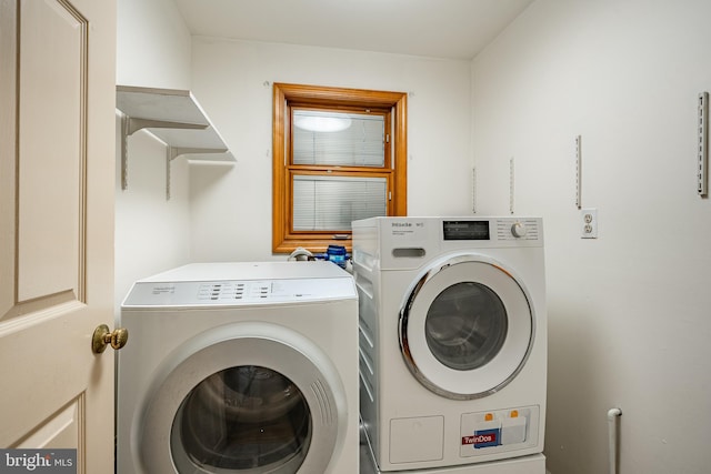 laundry room featuring separate washer and dryer