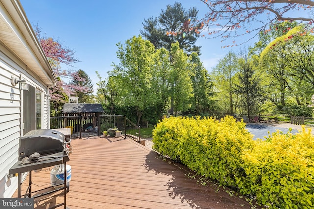 deck featuring a grill