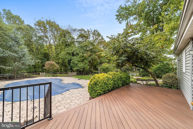 deck with a covered pool and a patio