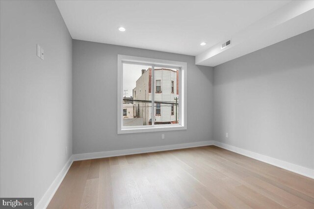 unfurnished room featuring light hardwood / wood-style floors