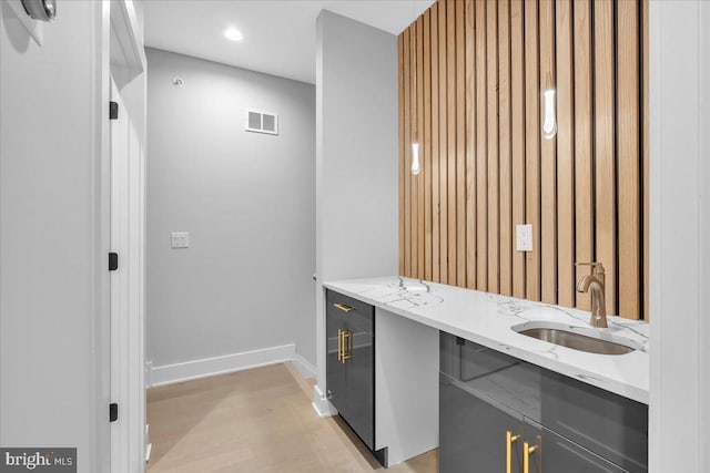 bathroom featuring sink and hardwood / wood-style floors