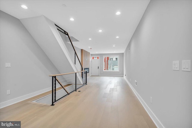 hallway with light wood-type flooring