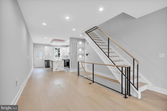 stairway featuring hardwood / wood-style flooring