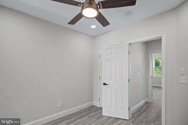 unfurnished bedroom with light hardwood / wood-style floors and ceiling fan