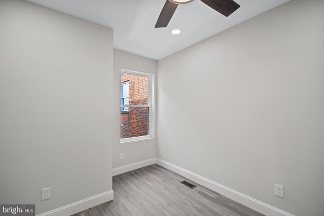 unfurnished room featuring light wood-type flooring and ceiling fan