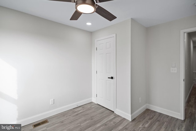 unfurnished bedroom featuring ceiling fan and hardwood / wood-style flooring