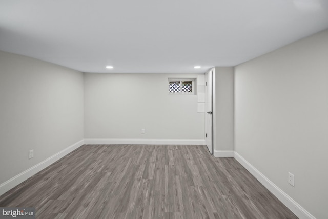 basement with dark wood-type flooring