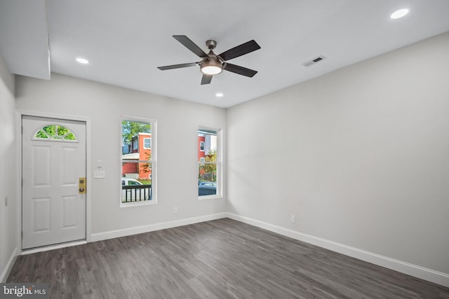 entrance foyer featuring ceiling fan and dark wood-type flooring