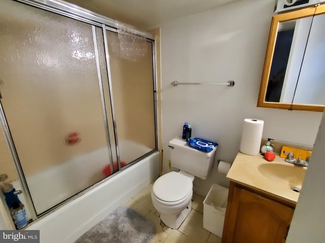 full bathroom with enclosed tub / shower combo, vanity, toilet, and tile patterned floors