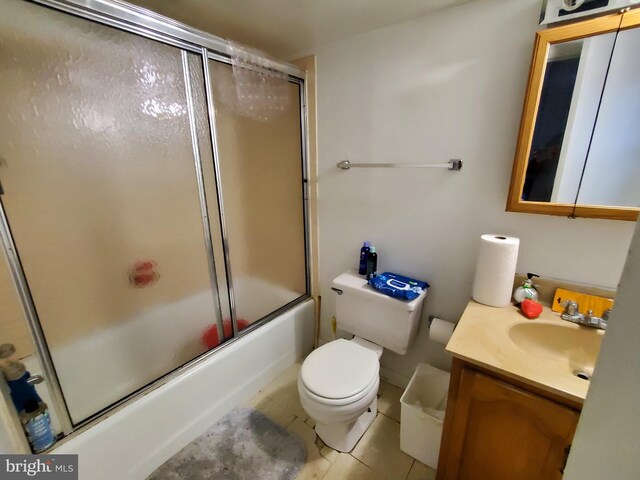 2821 5th St NE, Washington, DC 20017 - full bathroom featuring toilet, vanity, tile patterned floors, and enclosed tub / shower combo