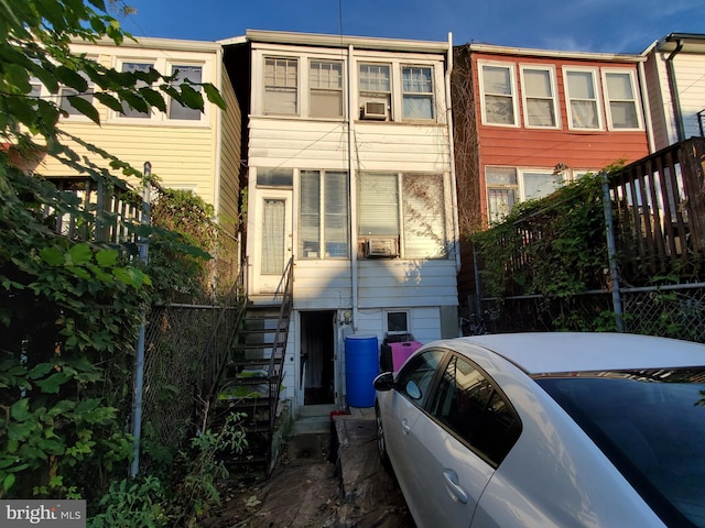 view of front of property featuring cooling unit